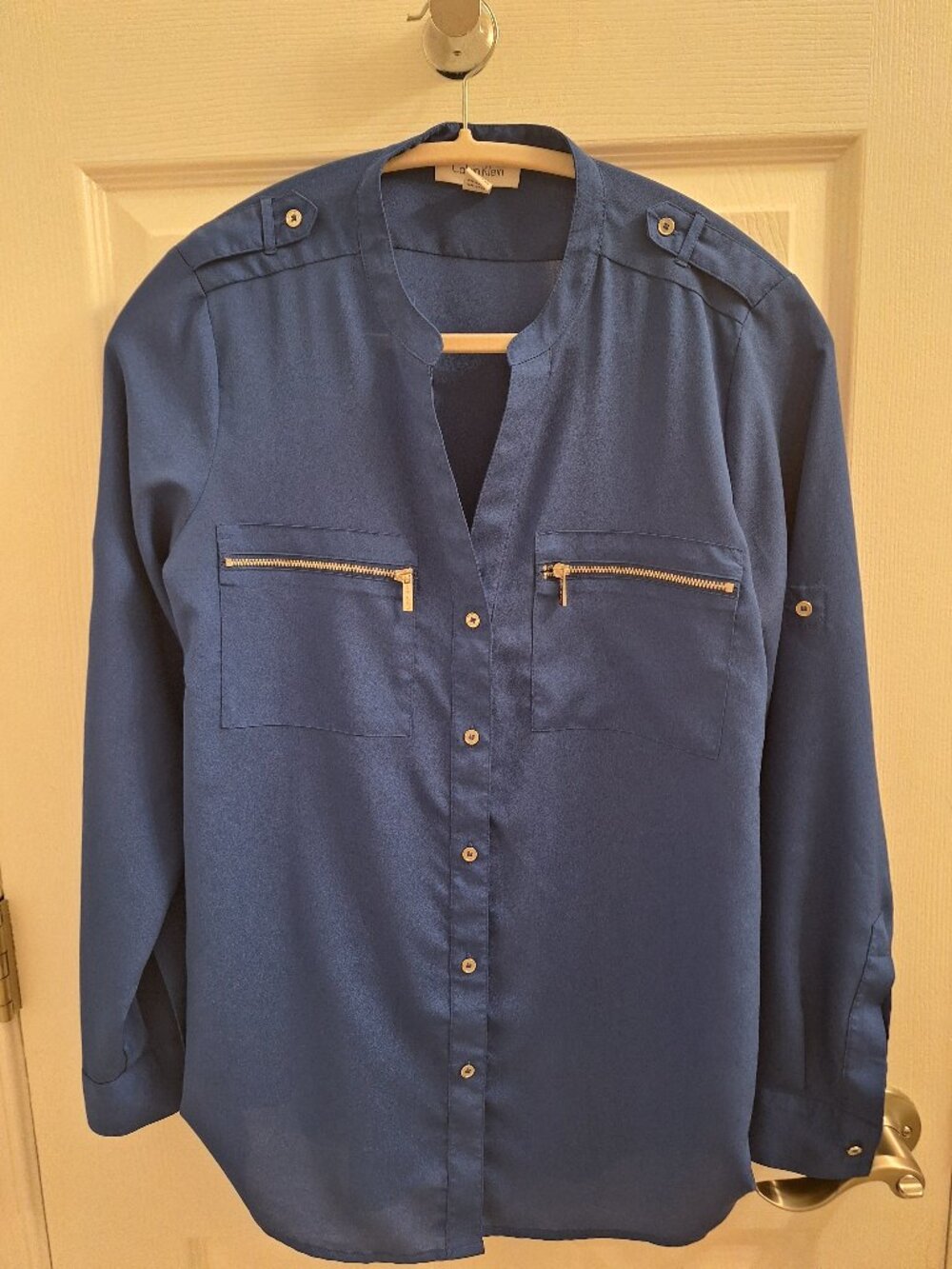 Calvin Klein blue button down blouse, size Small